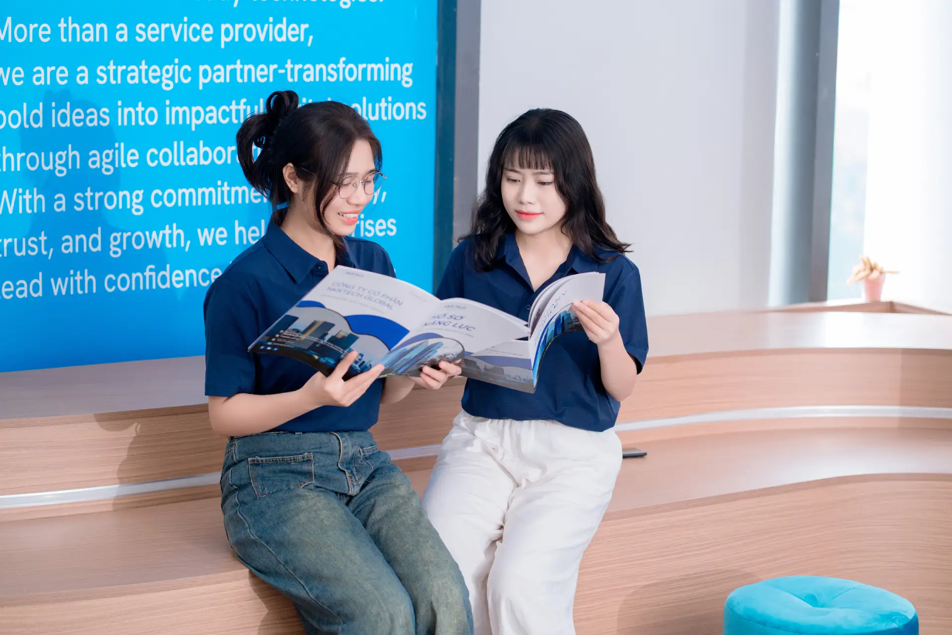 Professional team at NKKTech Global discussing innovative technical challenges